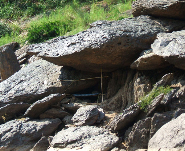 A rest shelter in the rocks on Mekong river bank