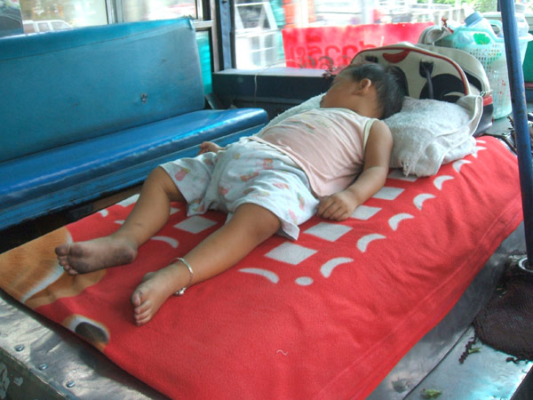 Baby taking nap on the bus