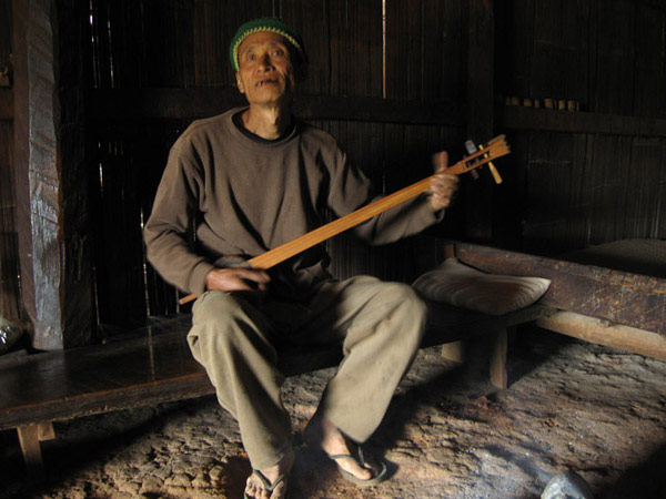Elderly Lisu people playing guitar