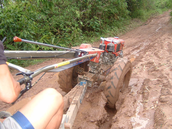 Tractoring the muddy road in Umphang